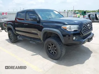 2020 Toyota Tacoma SR5 with VIN 3TMCZ5AN7LM312098, listed as a IAAI auction lot 42402862 with 63,984 mi miles and . Bid and sale history available at DreamBid. Image 1.