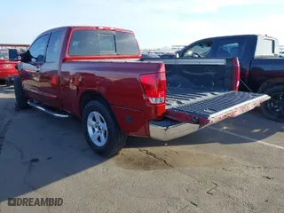 2004 Nissan Titan XE with VIN 1N6AA06A24N584067, listed as a IAAI auction lot 41568800 with 184,664 mi miles. Bid and sale history available at carsss.com. Image 3.
