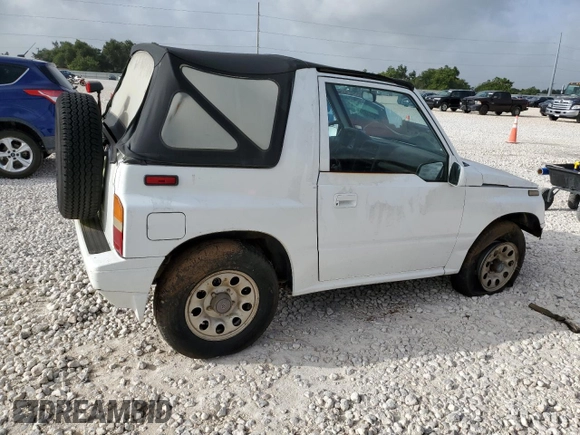 1994 Suzuki Sidekick z VIN 2S3TA01C8R6408593, wystawiony jako Copart lot #65011514 z przebiegiem 248 814 mil mil oraz Tytuł czysty. Historia ofert i sprzedaży dostępna na DreamBid. Obrazek 3.