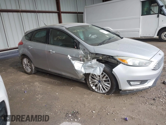 2015 Ford Focus Titanium z VIN 1FADP3N2XFL348149, wystawiony jako IAAI lot #41983021 z przebiegiem 208 765 mil mil oraz . Historia ofert i sprzedaży dostępna na DreamBid. Obrazek 13.