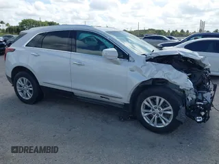 2021 Cadillac XT5 FWD Luxury with VIN 1GYKNAR40MZ146268, listed as a IAAI auction lot 41522802 with 61,775 mi miles. Bid and sale history available at carsss.com. Image 1.