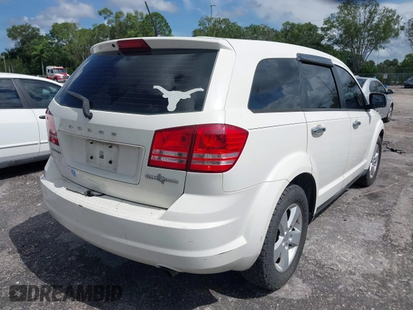 2013 Dodge Journey Canada Value z VIN 3C4PDCAB1DT646810, wystawiony jako IAAI lot #42484918 z przebiegiem 212 456 mil mil oraz . Historia ofert i sprzedaży dostępna na DreamBid. Obrazek 4.