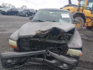 2002 Dodge Dakota with VIN 1B7FL16X62S683972, listed as a IAAI auction lot 41972271 with 158,436 mi miles and . Bid and sale history available at carsss.com. Image 6.