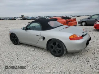 2001 Porsche Boxster с VIN WP0CA29821U621779, выставлен на аукционе Copart как лот 87204984 с пробегом 82 091 миль миль и Списание • Salvage title. История ставок и продаж доступна на DreamBid. Изображение 2.