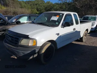 2003 Ford F-150 XL with VIN 1FTRX17W33NA66469, listed as a IAAI auction lot 41677909 with 236,619 mi miles. Bid and sale history available at carsss.com. Image 2.
