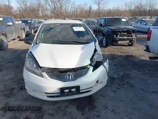 2009 Honda Fit z VIN JHMGE88249S067463, wystawiony jako IAAI lot #41354698 z przebiegiem 153 402 mil mil oraz . Historia ofert i sprzedaży dostępna na DreamBid. Obrazek 12.