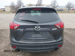 2014 Mazda CX-5 Grand Touring with VIN JM3KE4DY4E0343863, listed as a IAAI auction lot 41770402 with 117,615 mi miles. Bid and sale history available at carsss.com. Image 16.