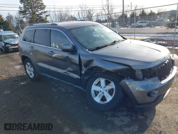2011 Jeep Grand Cherokee 70th Anniversary with VIN 1J4RR4GT6BC715848, listed as a IAAI auction lot 41562152 with 119,910 mi miles. Bid and sale history available at carsss.com. Image 1.