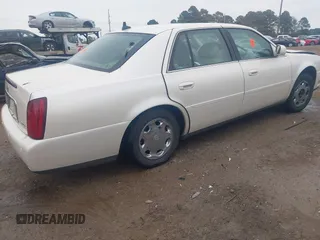 2002 Cadillac DeVille DHS z VIN 1G6KE57YX2U212020, wystawiony jako IAAI lot #41287342 z przebiegiem Nie podano mil oraz . Historia ofert i sprzedaży dostępna na DreamBid. Obrazek 4.