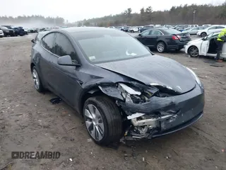 2022 Tesla Model Y Long Range z VIN 7SAYGDEE1NA021734, wystawiony jako IAAI lot #41716518 z przebiegiem 30 112 mil mil oraz . Historia ofert i sprzedaży dostępna na DreamBid. Obrazek 1.