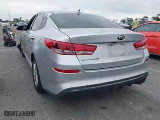 2019 Kia Optima LX with VIN 5XXGT4L3XKG285486, listed as a IAAI auction lot 41872981 with 101,981 mi miles. Bid and sale history available at carsss.com. Image 3.