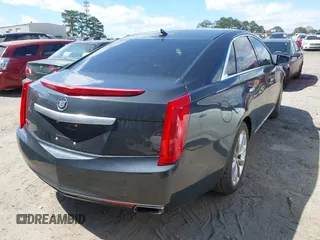 2013 Cadillac XTS Premium with VIN 2G61S5S33D9113653, listed as a IAAI auction lot 41837117 with 101,049 mi miles and . Bid and sale history available at DreamBid. Image 4.