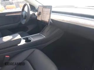 2025 Tesla Model Y Long Range with VIN 7SAYGDED0SF256230, listed as a IAAI auction lot 41356520 with 262 mi miles and . Bid and sale history available at DreamBid. Image 5.