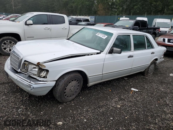 1990 Mercedes-Benz 300 with VIN WDBCA25D9LA550909, listed as a Copart auction lot 82717124 with 221,701 mi miles and Salvage Title. Bid and sale history available at DreamBid. Image 1.