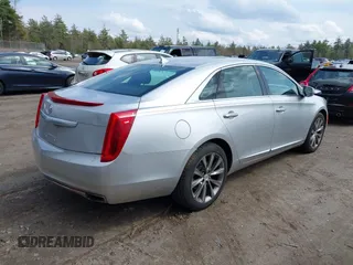 2013 Cadillac XTS Luxury z VIN 2G61P5S33D9170453, wystawiony jako IAAI lot #41928607 z przebiegiem 68 094 mil mil oraz . Historia ofert i sprzedaży dostępna na DreamBid. Obrazek 4.