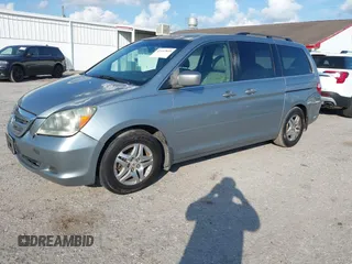 2006 Honda Odyssey EX-L with VIN 5FNRL38796B077297, listed as a IAAI auction lot 41492810 with 292,164 mi miles and . Bid and sale history available at carsss.com. Image 2.