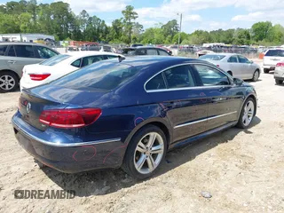 2014 Volkswagen CC R-Line with VIN WVWBP7AN7EE507463, listed as a IAAI auction lot 41984136 with 100,531 mi miles. Bid and sale history available at carsss.com. Image 4.