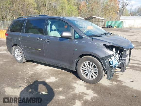 2014 Toyota Sienna XLE with VIN 5TDYK3DC5ES475750, listed as a IAAI auction lot 41976805 with 221,804 mi miles. Bid and sale history available at carsss.com. Image 1.