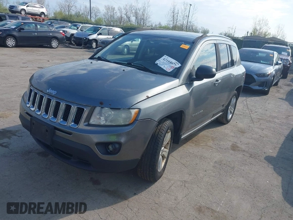 2013 Jeep Compass Sport with VIN 1C4NJCBB2DD174668, listed as a IAAI auction lot 42104977 with 213,123 mi miles. Bid and sale history available at carsss.com. Image 2.