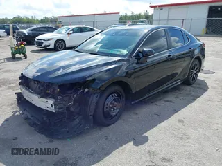 2023 Toyota Camry SE with VIN 4T1G11AK6PU741172, listed as a IAAI auction lot 41599909 with 56,668 mi miles and . Bid and sale history available at DreamBid. Image 2.