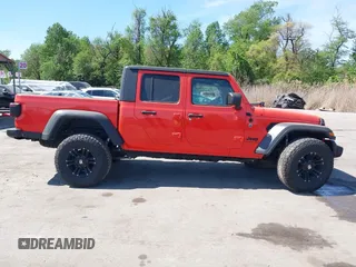 2020 Jeep Gladiator Sport S z VIN 1C6HJTAG0LL149161, wystawiony jako IAAI lot #42071132 z przebiegiem 153 062 mil mil oraz . Historia ofert i sprzedaży dostępna na DreamBid. Obrazek 13.