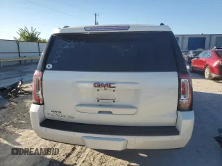 2015 GMC Yukon XL SLT with VIN 1GKS1HKC6FR166415, listed as a Copart auction lot 73029014 with 105,209 mi miles and Salvage Title. Bid and sale history available at carsss.com. Image 6.