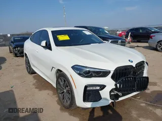 2021 BMW X6 sDrive40i z VIN 5UXCY4C07M9D99548, wystawiony jako IAAI lot #41511996 z przebiegiem 47 282 mil mil oraz . Historia ofert i sprzedaży dostępna na DreamBid. Obrazek 1.