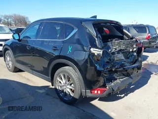 2021 Mazda CX-5 Grand Touring with VIN JM3KFADM1M0406098, listed as a IAAI auction lot 41654735 with 33,050 mi miles. Bid and sale history available at carsss.com. Image 3.