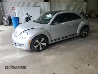 2012 Volkswagen Beetle with VIN 3VWV67AT1CM663839, listed as a Copart auction lot 55009455 with 122,042 mi miles and Salvage Title. Bid and sale history available at DreamBid. Image 1.