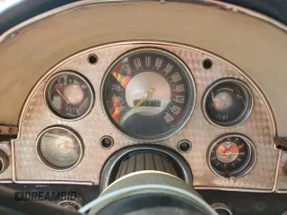 1957 Ford Thunderbird with VIN D7FH395675, listed as a Copart auction lot 77234434 with 15,312 mi miles and Salvage Title. Bid and sale history available at DreamBid. Image 9.