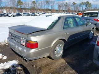 2001 Cadillac Seville Luxury SLS w/Monochrome Pkg with VIN 1G6KS54YX1U103892, listed as a IAAI auction lot 41550499 with 999,999 mi miles. Bid and sale history available at carsss.com. Image 4.