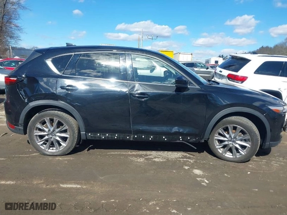2021 Mazda CX-5 Grand Touring with VIN JM3KFBDM3M1318248, listed as a IAAI auction lot 41678260 with 71,903 mi miles. Bid and sale history available at carsss.com. Image 13.