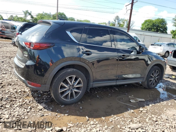 2018 Mazda CX-5 Grand Touring with VIN JM3KFBDM6J0345848, listed as a Copart auction lot 61587865 with 107,193 mi miles and Salvage title. Bid and sale history available at DreamBid. Image 3.