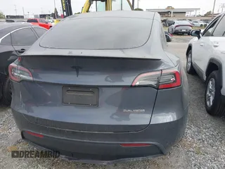 2023 Tesla Model Y Performance z VIN 7SAYGDEF6PF774965, wystawiony jako IAAI lot #41655550 z przebiegiem 33 824 mil mil oraz . Historia ofert i sprzedaży dostępna na DreamBid. Obrazek 16.
