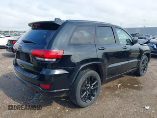 2021 Jeep Grand Cherokee Laredo E with VIN 1C4RJEAG0MC571375, listed as a IAAI auction lot 42087648 with 29,358 mi miles and . Bid and sale history available at DreamBid. Image 4.