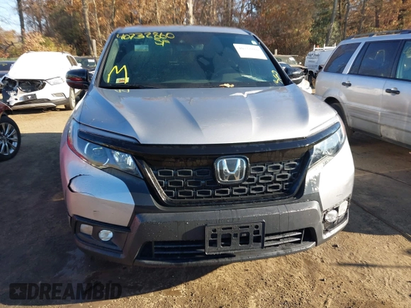 2021 Honda Passport EX-L with VIN 5FNYF8H54MB042677, listed as a IAAI auction lot 40732860 with 63,698 mi miles and . Bid and sale history available at DreamBid. Image 12.