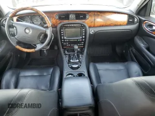 2004 Jaguar XJ with VIN SAJWA73B64TG30921, listed as a Copart auction lot 71267074 with 20,031 mi miles and Salvage Title. Bid and sale history available at carsss.com. Image 8.