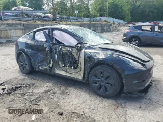 2024 Tesla Model Y Long Range with VIN 7SAYGDEE7RA327259, listed as a Copart auction lot 57494435 with Not provided miles and Salvage title. Bid and sale history available at DreamBid. Image 4.