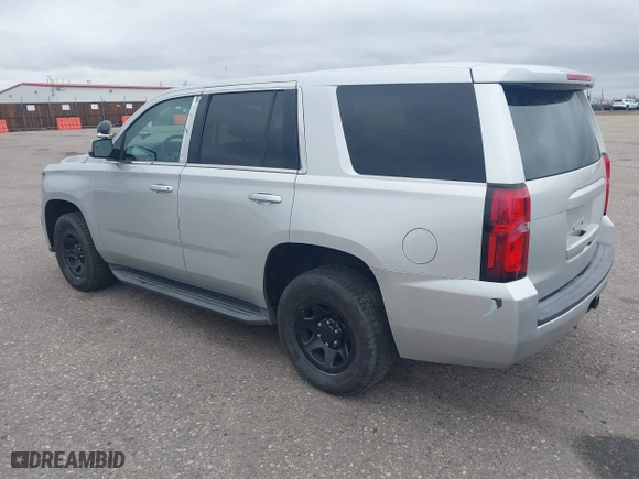 2015 Chevrolet Tahoe Commercial with VIN 1GNSK2ECXFR681555, listed as a IAAI auction lot 41975359 with 126,785 mi miles. Bid and sale history available at carsss.com. Image 3.