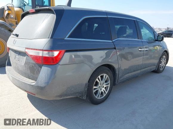 2012 Honda Odyssey EX-L with VIN 5FNRL5H69CB128585, listed as a IAAI auction lot 41695109 with 231,565 mi miles and . Bid and sale history available at carsss.com. Image 4.