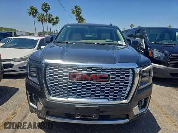 2021 GMC Yukon Denali with VIN 1GKS2DKLXMR125059, listed as a IAAI auction lot 42132398 with 72,384 mi miles. Bid and sale history available at carsss.com. Image 1.