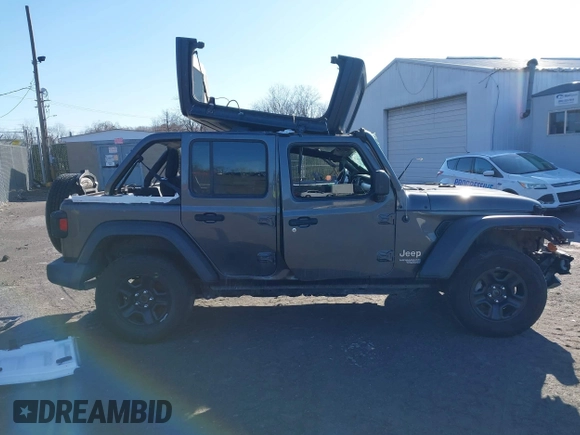 2019 Jeep Wrangler Unlimited Sport S with VIN 1C4HJXDG7KW572294, listed as a IAAI auction lot 41607986 with 61,734 mi miles and . Bid and sale history available at DreamBid. Image 13.