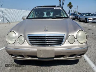 2000 Mercedes-Benz E-Class AWD with VIN WDBJH82J8YX042547, listed as a Copart auction lot 58063494 with 138,392 mi miles and Salvage Title. Bid and sale history available at carsss.com. Image 5.