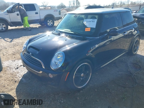 2006 MINI Hardtop S with VIN WMWRE33546TJ34712, listed as a IAAI auction lot 41144701 with 230,006 mi miles and . Bid and sale history available at DreamBid. Image 2.