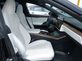 2023 Tesla Model S with VIN 5YJSA1E52PF528795, listed as a IAAI auction lot 42110660 with 21,243 mi miles and . Bid and sale history available at DreamBid. Image 5.