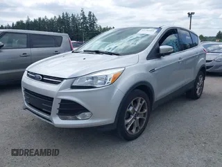 2013 Ford Escape SEL with VIN 1FMCU0HX5DUB53695, listed as a IAAI auction lot 42795881 with 165,330 mi miles and . Bid and sale history available at DreamBid. Image 2.