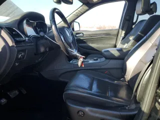 2020 Jeep Grand Cherokee Overland with VIN 1C4RJFCG2LC230688, listed as a Copart auction lot 86249654 with 67,882 mi miles and Salvage Title. Bid and sale history available at carsss.com. Image 7.
