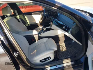 2018 BMW 5 Series M550i xDrive with VIN WBAJB9C59JG463948, listed as a IAAI auction lot 41845989 with 99,385 mi miles. Bid and sale history available at carsss.com. Image 5.