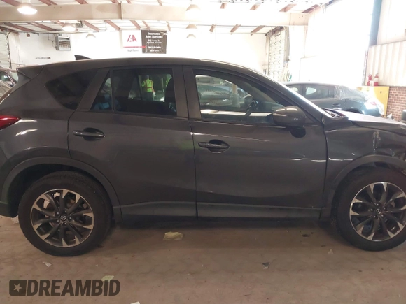 2016 Mazda CX-5 Grand Touring with VIN JM3KE2DYXG0846787, listed as a IAAI auction lot 41346364 with 113,553 mi miles. Bid and sale history available at carsss.com. Image 13.