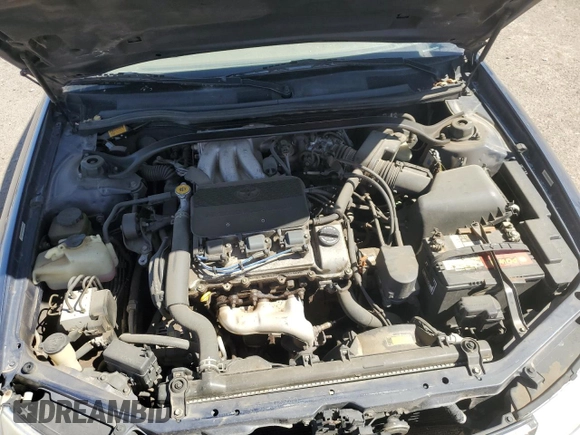 2000 Toyota Solara SE z VIN 2T1CF28P0YC350027, wystawiony jako Copart lot #52181555 z przebiegiem 220 178 mil mil oraz Szkoda całkowita • Salvage title. Historia ofert i sprzedaży dostępna na DreamBid. Obrazek 11.